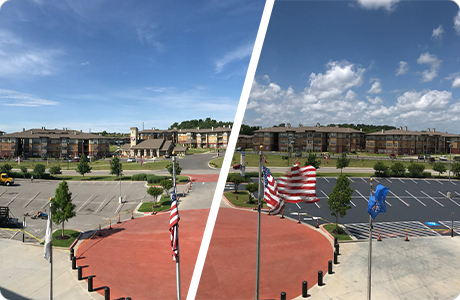 Before and After Crack Sealing and Asphalt Resurfacing Comparison of before and after crack sealing and asphalt resurfacing for a large parking lot outside residential buildings with American flags in the foreground