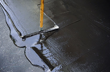 Freshly Paved Commercial Parking Lot with Line Striping Freshly paved commercial parking lot with clear white line striping in front of a business building